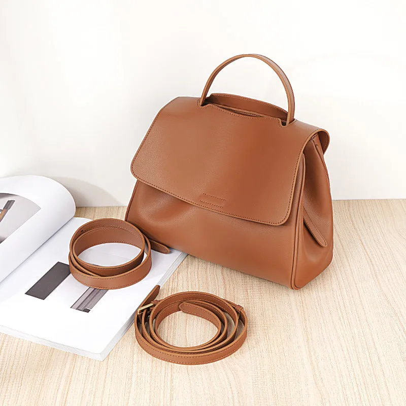 Soft genuine leather women's shoulder messenger bag in black, horizontal square shape with sewing thread detail