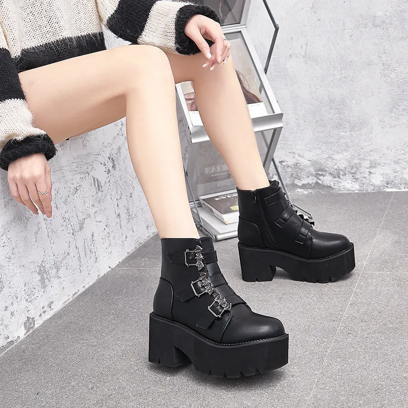 Black women's punk gothic Martin boots with bat buckle detail and side zipper.