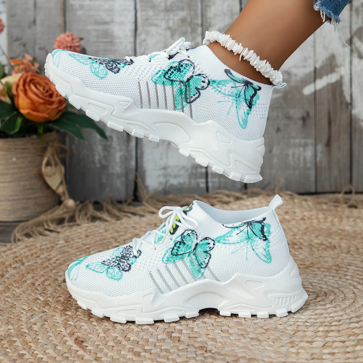 Butterfly print mesh sneakers for women in blue with flat heel, round toe, and front lace-up