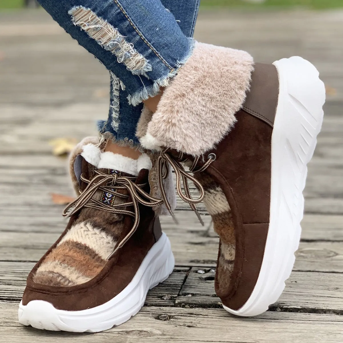 Women's beige suede lace-up snow boots with thick rubber soles and plush lining