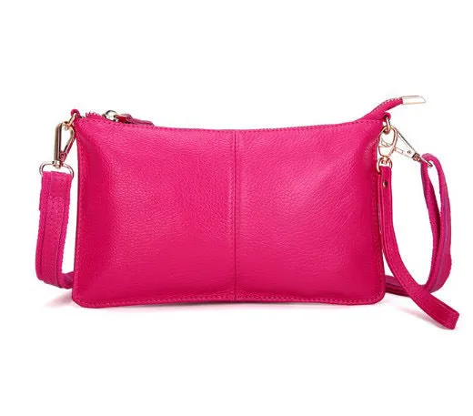 Lady's cowhide leather slant bag in apricot colour with hand strap and shoulder strap showing zipper compartments