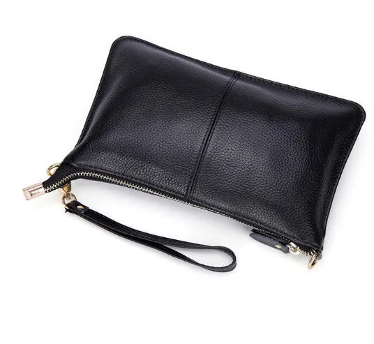Lady's cowhide leather slant bag in apricot colour with hand strap and shoulder strap showing zipper compartments