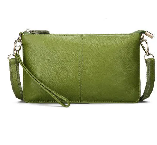 Lady's cowhide leather slant bag in apricot colour with hand strap and shoulder strap showing zipper compartments