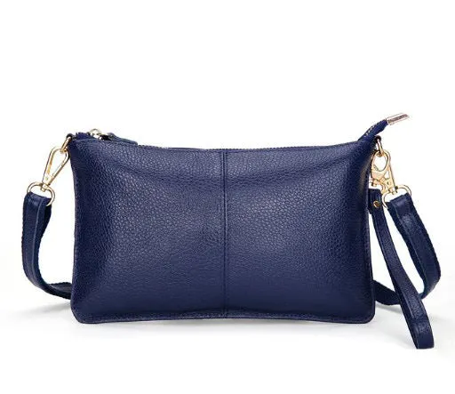 Lady's cowhide leather slant bag in apricot colour with hand strap and shoulder strap showing zipper compartments