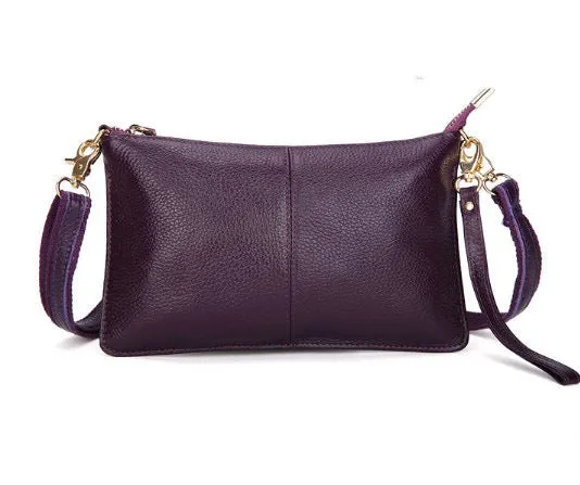 Lady's cowhide leather slant bag in apricot colour with hand strap and shoulder strap showing zipper compartments