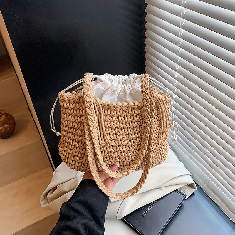 Knitted bucket shoulder bag in beige with external sandwich pocket and sewing thread detail for women