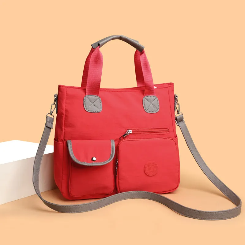 Women's nylon large-capacity crossbody bag in black with organised compartments and single shoulder strap