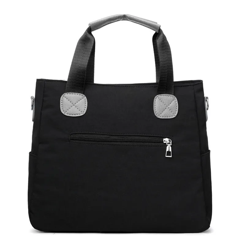 Women's nylon large-capacity crossbody bag in black with organised compartments and single shoulder strap