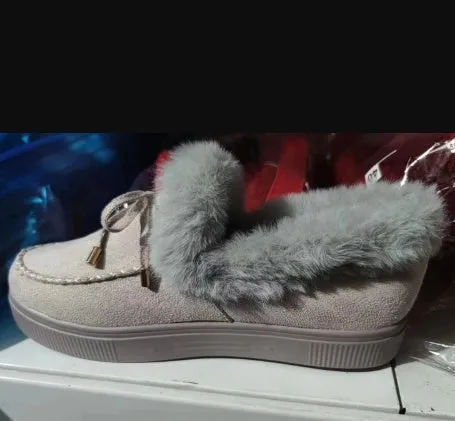 White cotton slipper shoes with a round toe, velvet lining, and a grey rubber non-slip sole.