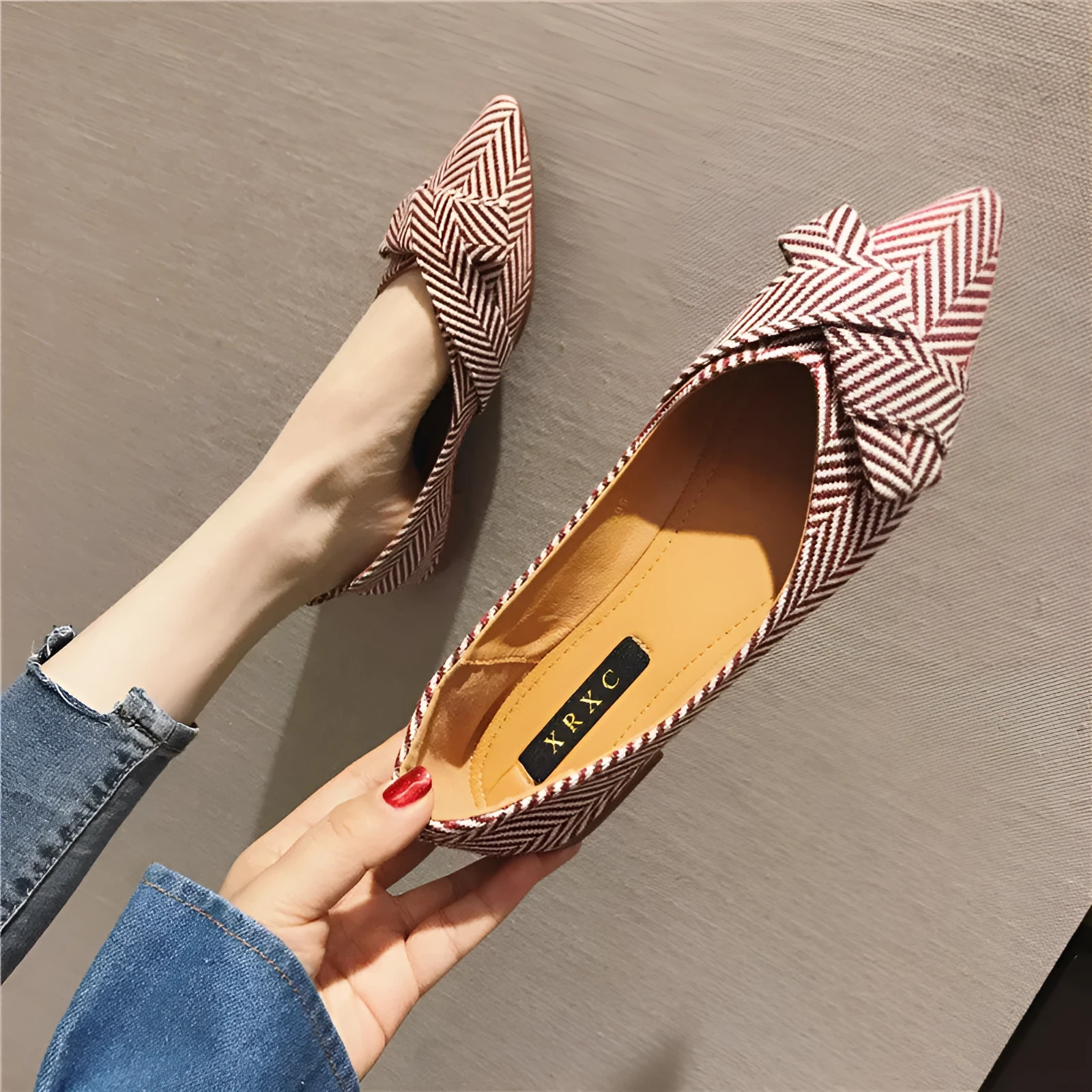 Women's black and red pointed toe shallow mouth casual shoes with a low flat heel.