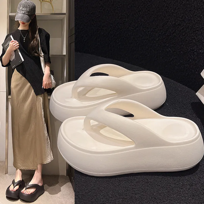 Women's thick-soled height increasing flip-flops in black with herringbone EVA upper