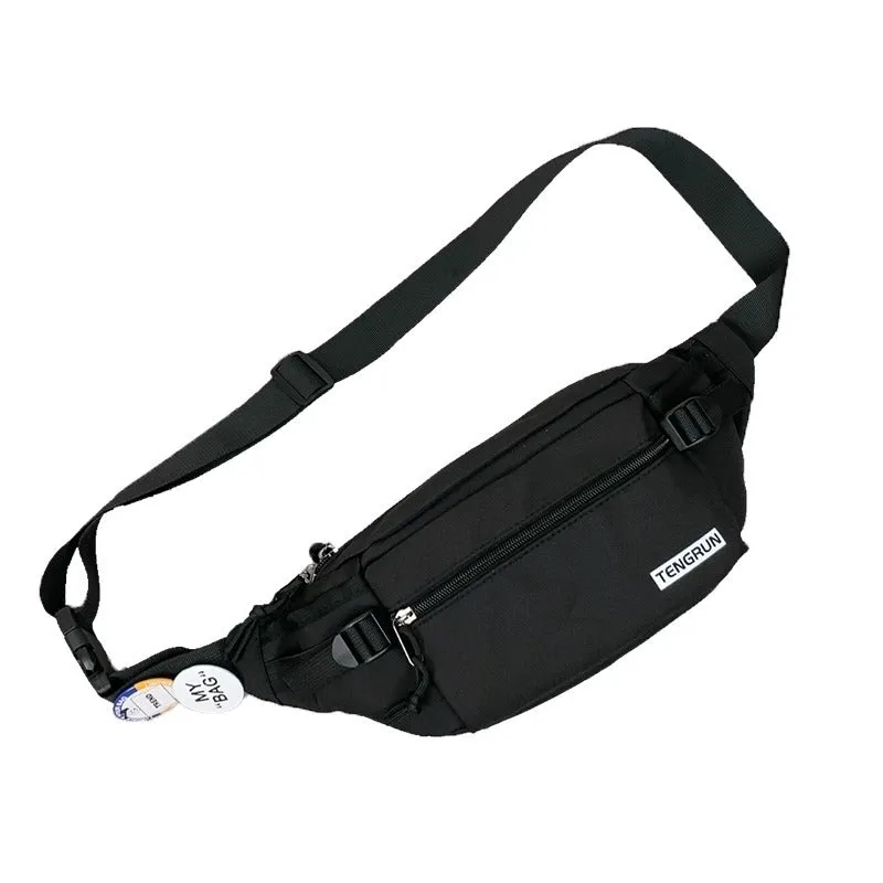 Trendy chest bag for men in Oxford cloth with letter pattern, adjustable strap, and two random badges on a plain background