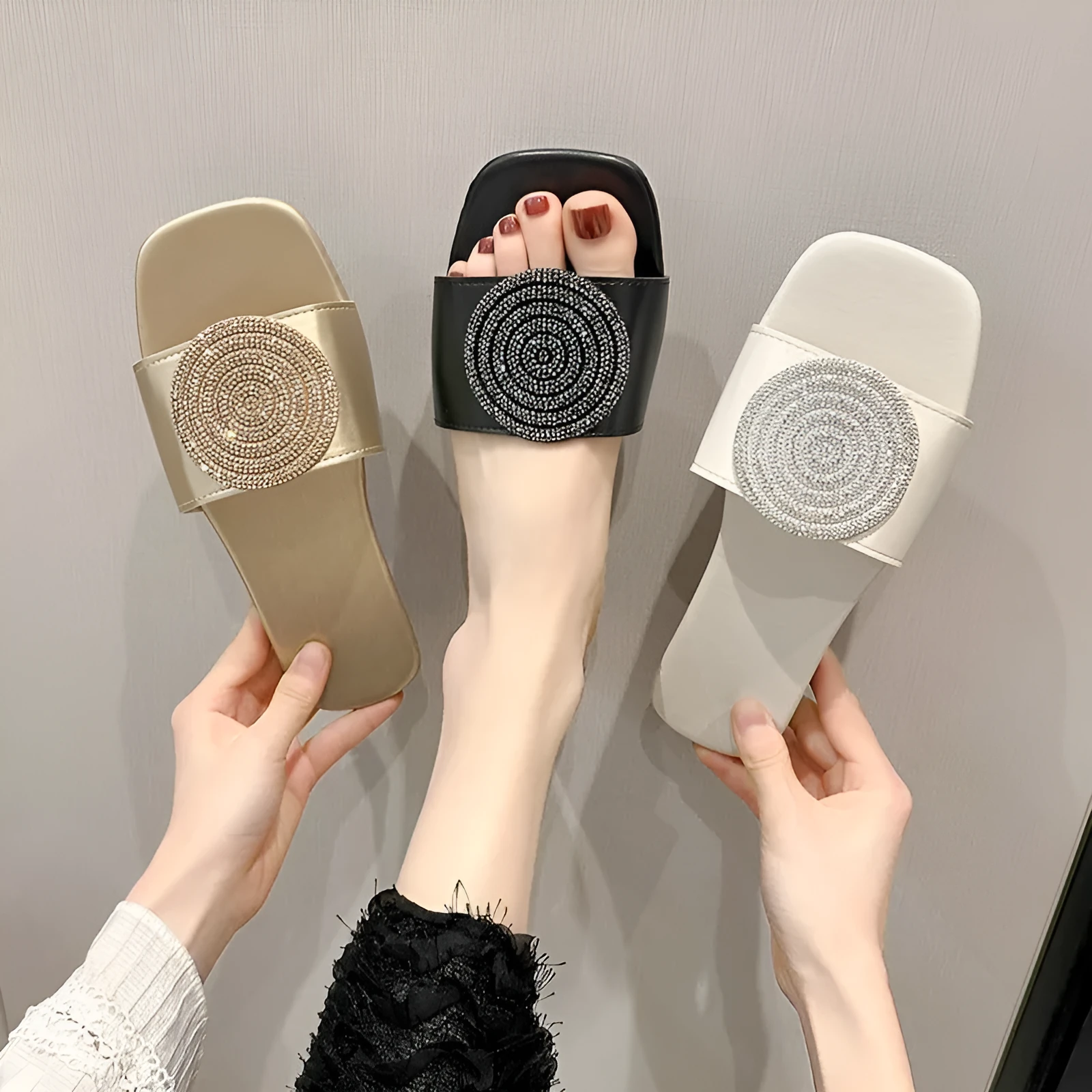 Open toe PU slippers with rhinestone decoration, available in black, white, and gold colours, sizes 36 to 43