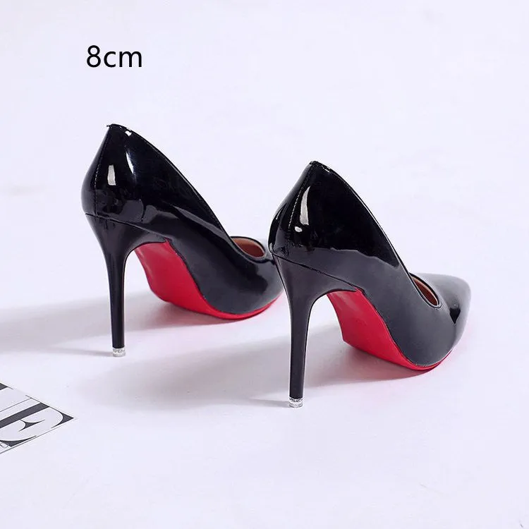 Women's black stiletto heel pump with pointed toe and shallow mouth design on a white background.