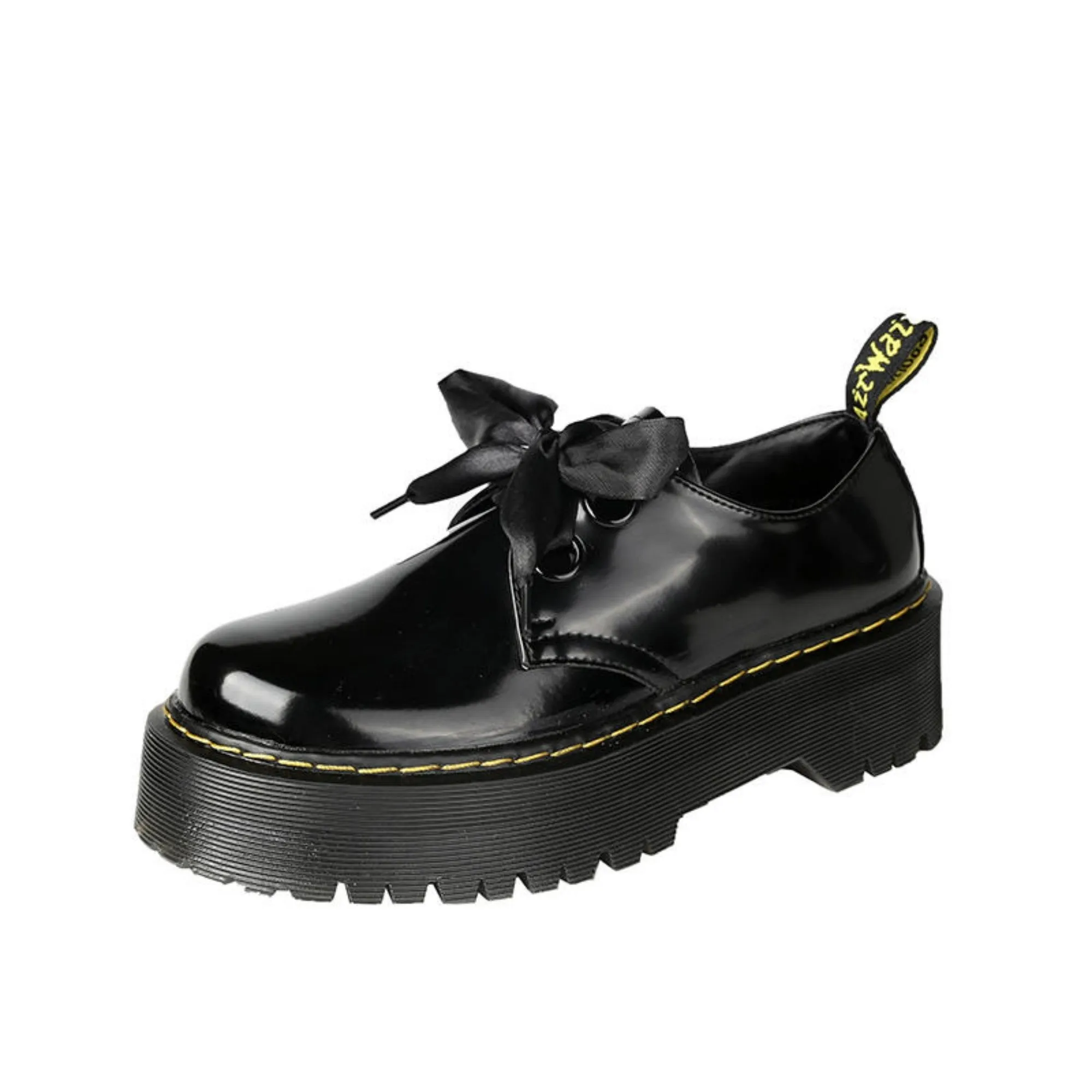 Black women's lace-up shoes with a thick sole, ribbon detail, and cross straps.