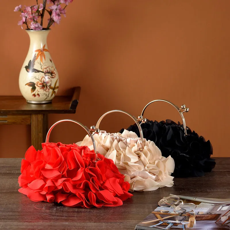 Handheld ladies' polyester banquet bag in soft dumpling shape with flower detail, black colour