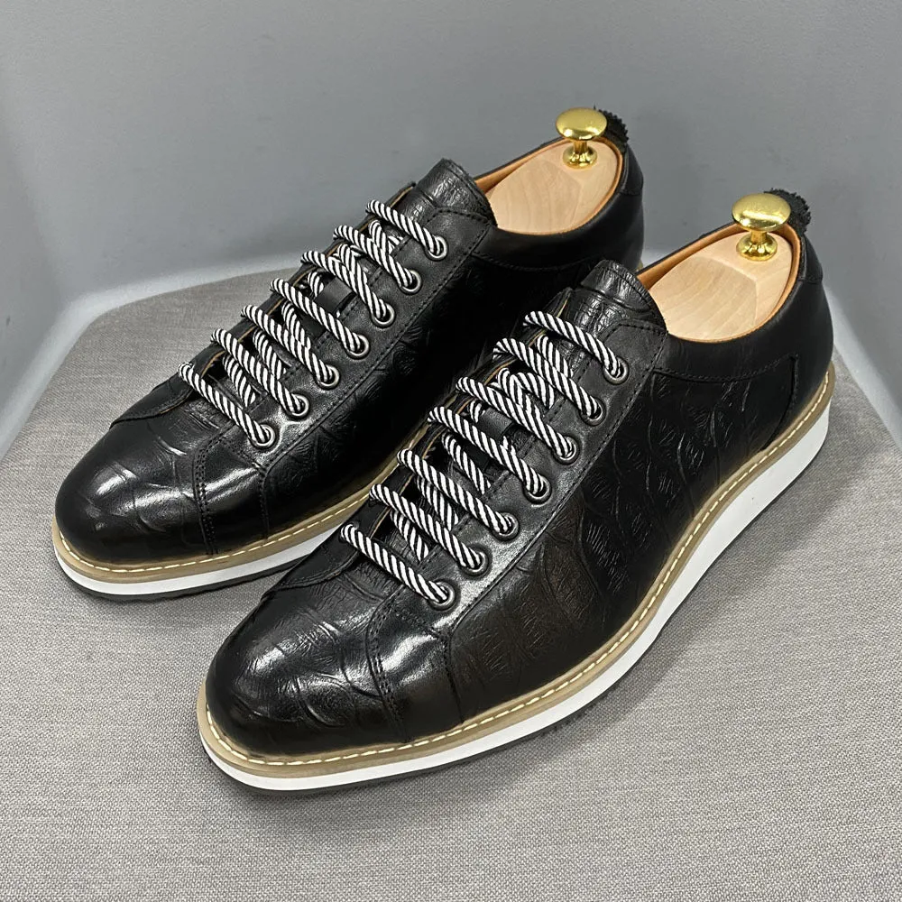 Men's white low-top lace-up shoes with an embossed patterned upper, shown on a plain background.
