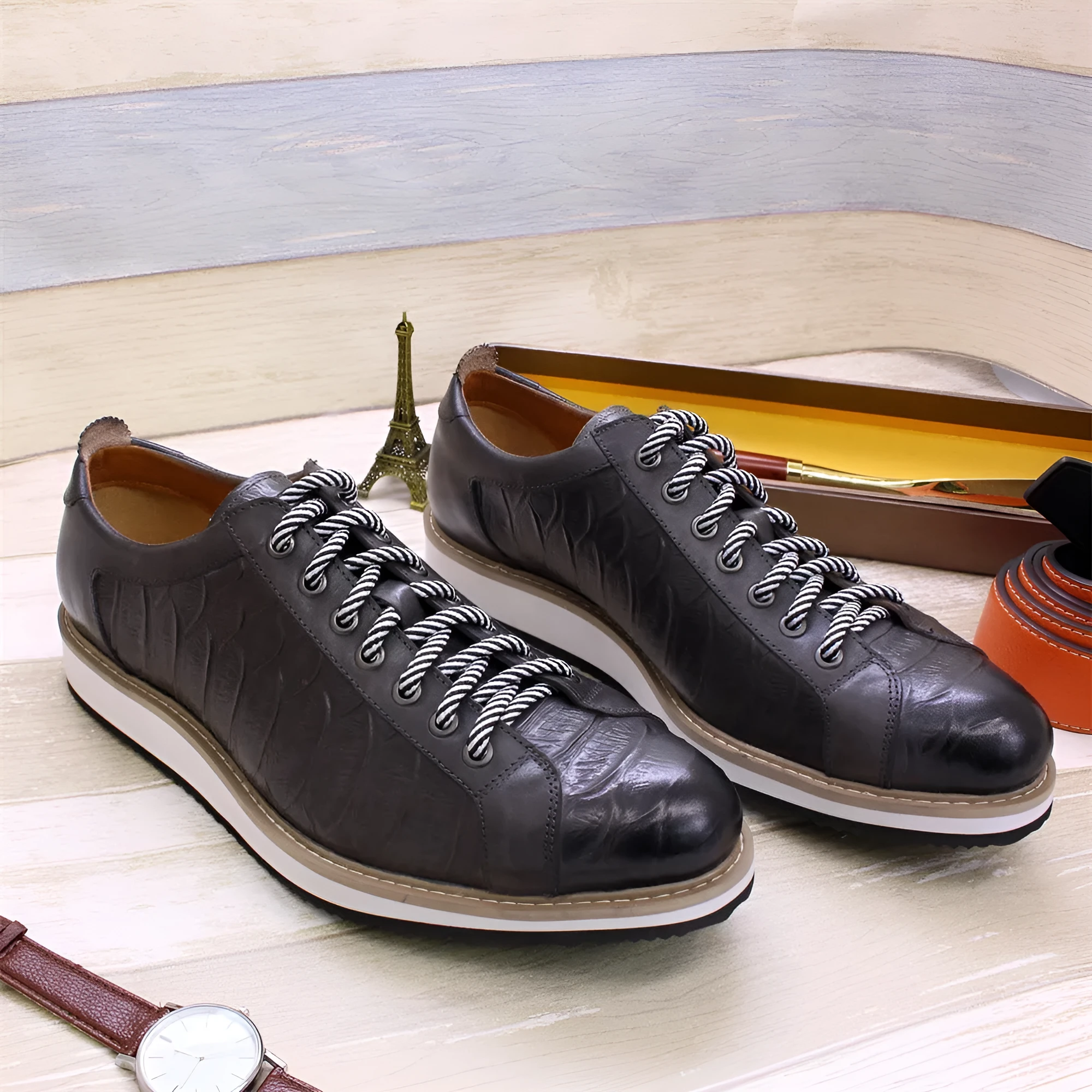 Men's white low-top lace-up shoes with an embossed patterned upper, shown on a plain background.