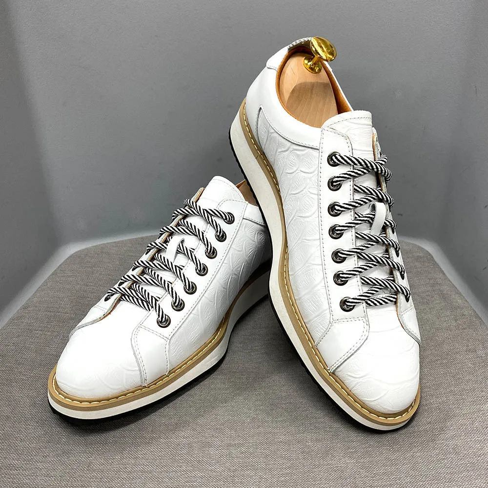 Men's white low-top lace-up shoes with an embossed patterned upper, shown on a plain background.