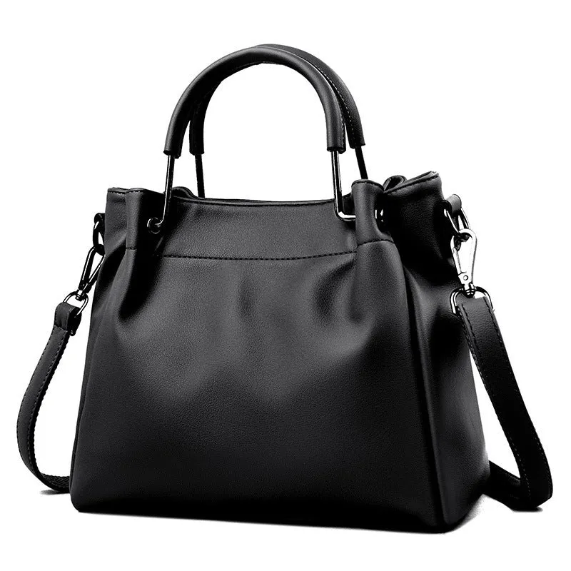 Soft PU leather bucket bag in black with visible sewing thread and external slit pocket