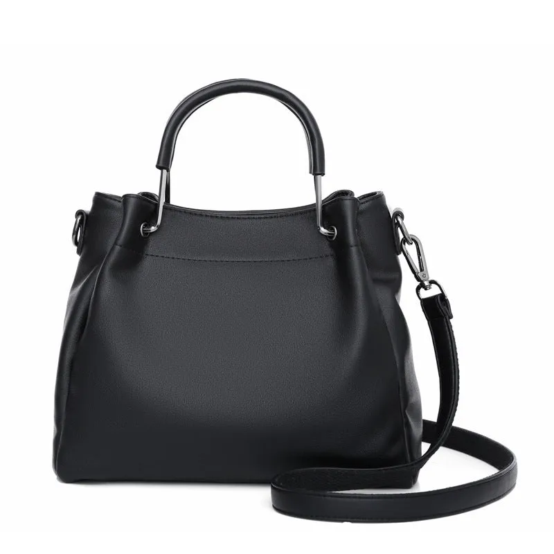 Soft PU leather bucket bag in black with visible sewing thread and external slit pocket