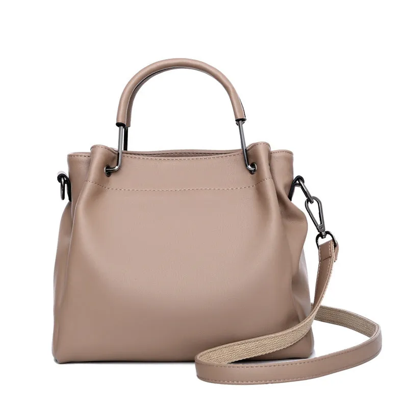 Soft PU leather bucket bag in black with visible sewing thread and external slit pocket