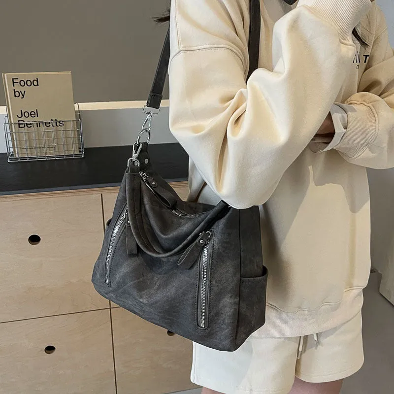 Large capacity women's casual shoulder bag in PU with sewing thread detail, available in denim blue, khaki, dark brown, light blue