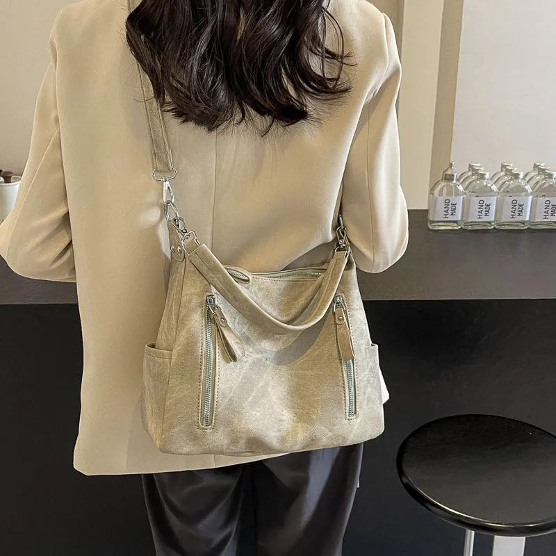Large capacity women's casual shoulder bag in PU with sewing thread detail, available in denim blue, khaki, dark brown, light blue