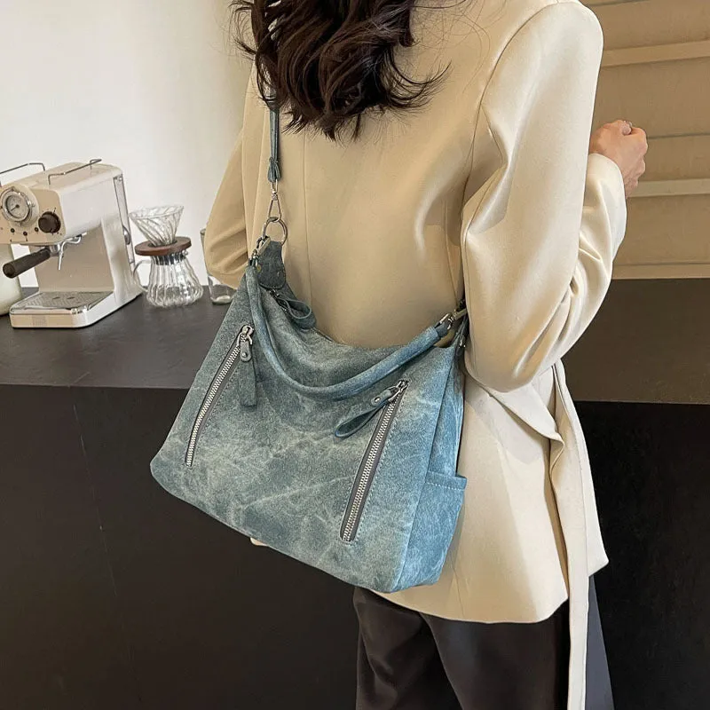 Large capacity women's casual shoulder bag in PU with sewing thread detail, available in denim blue, khaki, dark brown, light blue