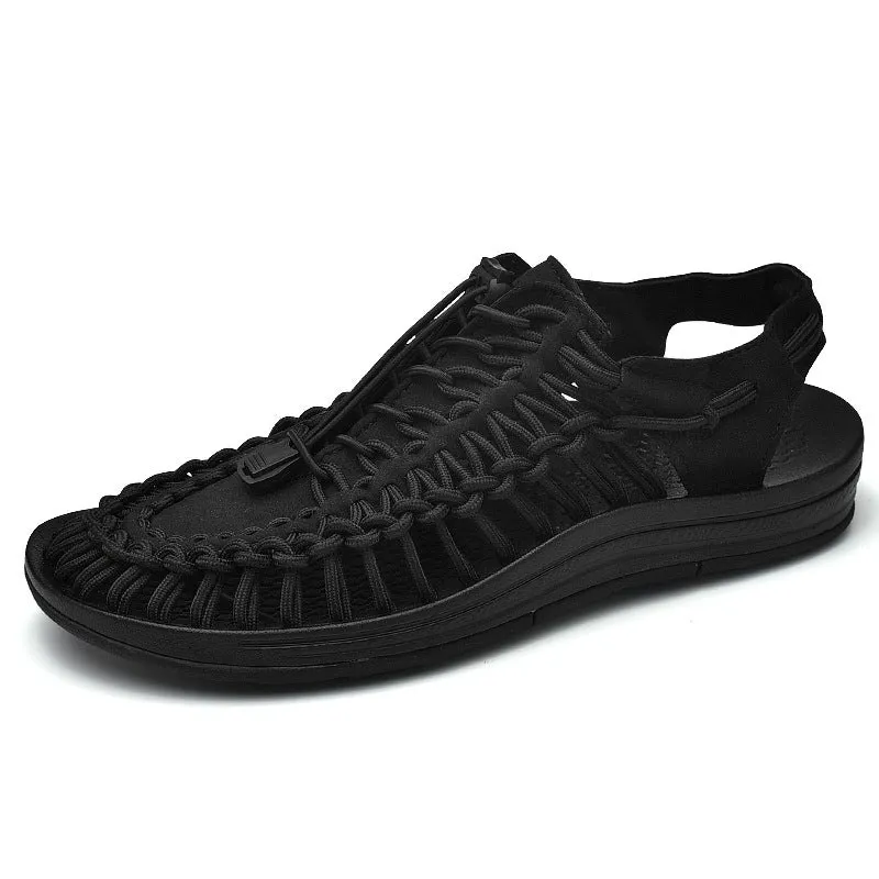 Woven Roman-style sandals with elastic drawstrings in rainbow colour on a rubber sole.