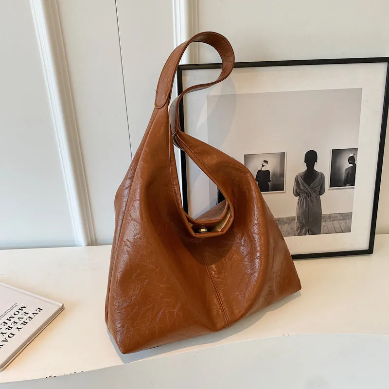 Soft leather shoulder bag with large capacity and sandwich pocket in street trend style