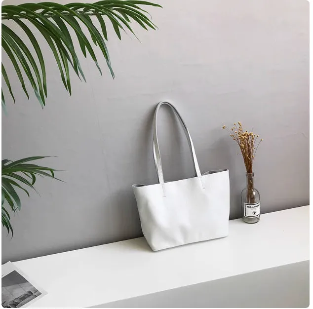 Lightweight medium cowhide leather tote bag for women with zip closure and double joint shoulder strap