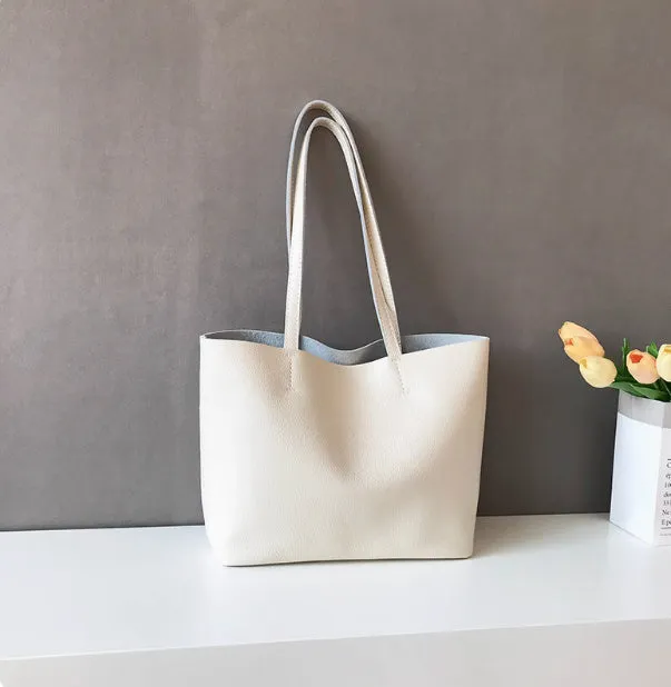 Lightweight medium cowhide leather tote bag for women with zip closure and double joint shoulder strap