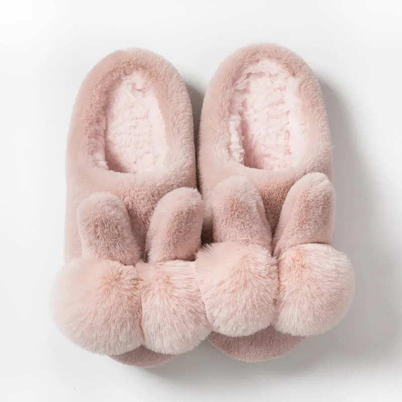 Women's fluffy rabbit fur slippers with floral pattern, high upper, and low heel in multiple colours.