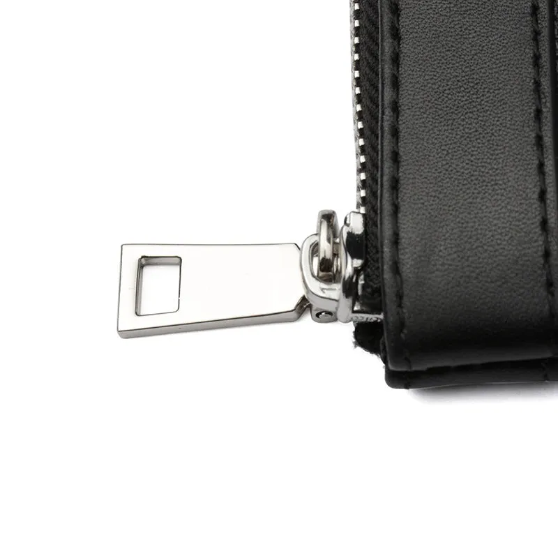 Black genuine cowhide leather men's clutch wallet showing its 20x10 cm size.