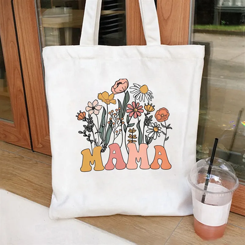 Women's canvas tote bag with printed letter pattern and chain detail in urban simplicity style