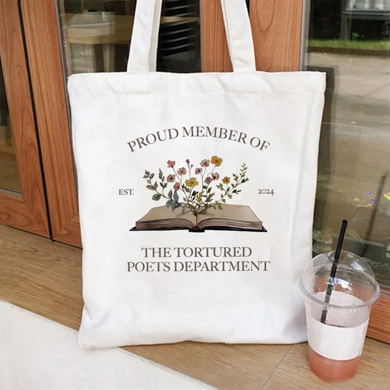 Women's canvas tote bag with printed letter pattern and chain detail in urban simplicity style