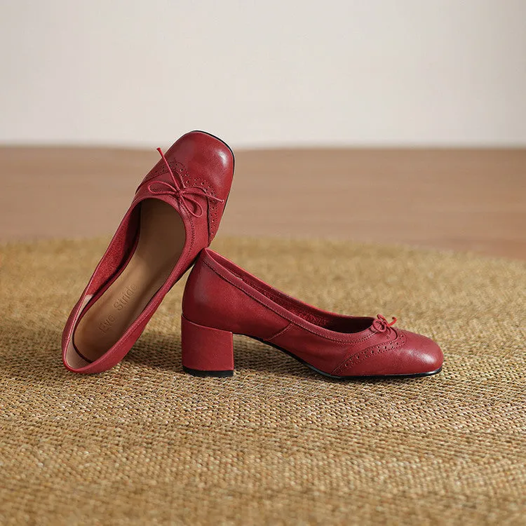 Women's round toe mid heel chunky leather pumps in solid colour with bow detail