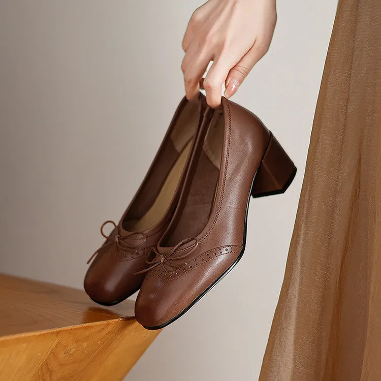 Women's round toe mid heel chunky leather pumps in solid colour with bow detail