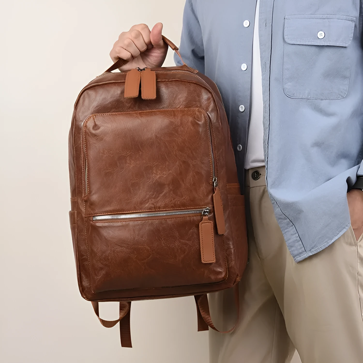 American Vintage large capacity waterproof backpack in solid colour with curved shoulder strap and sewing line detail