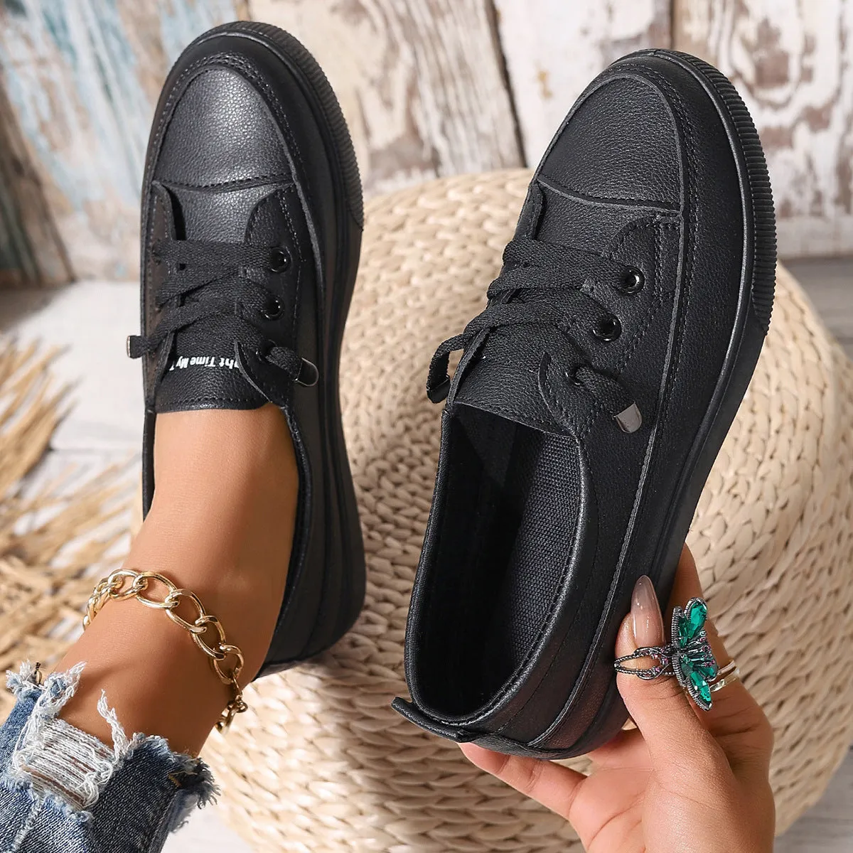 Women's casual lace-up shoes in white with round toe and rubber sole, side view