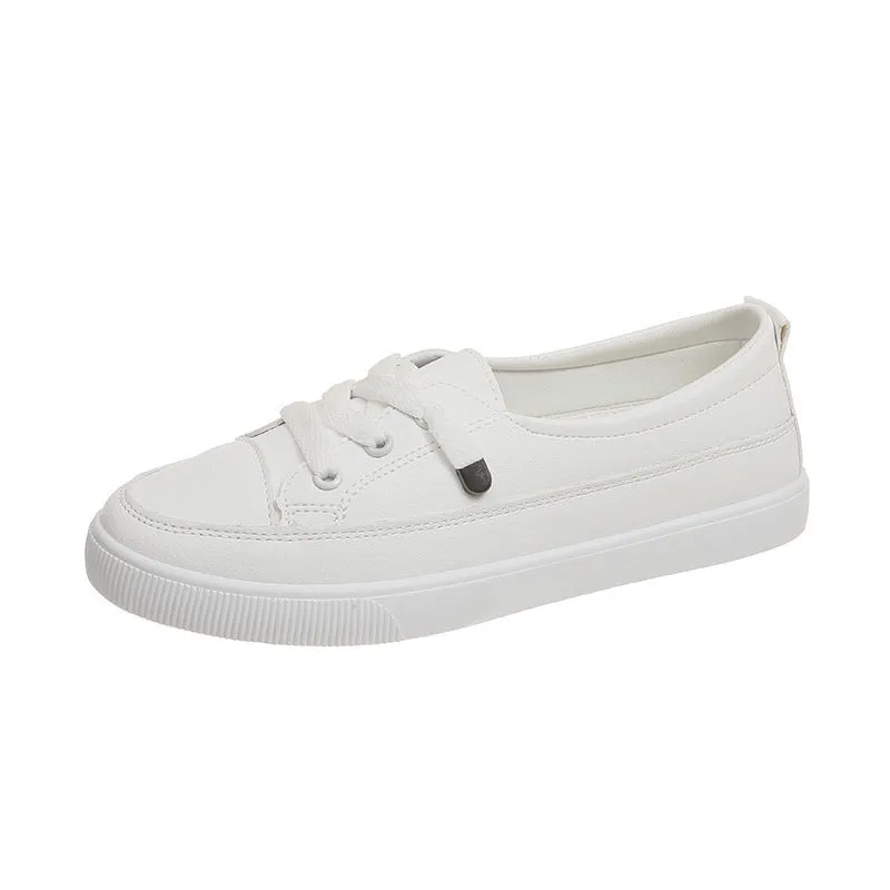 Women's casual lace-up shoes in white with round toe and rubber sole, side view