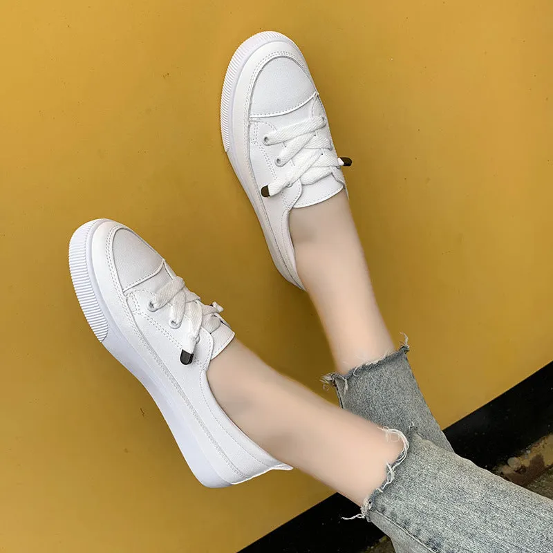 Women's casual lace-up shoes in white with round toe and rubber sole, side view