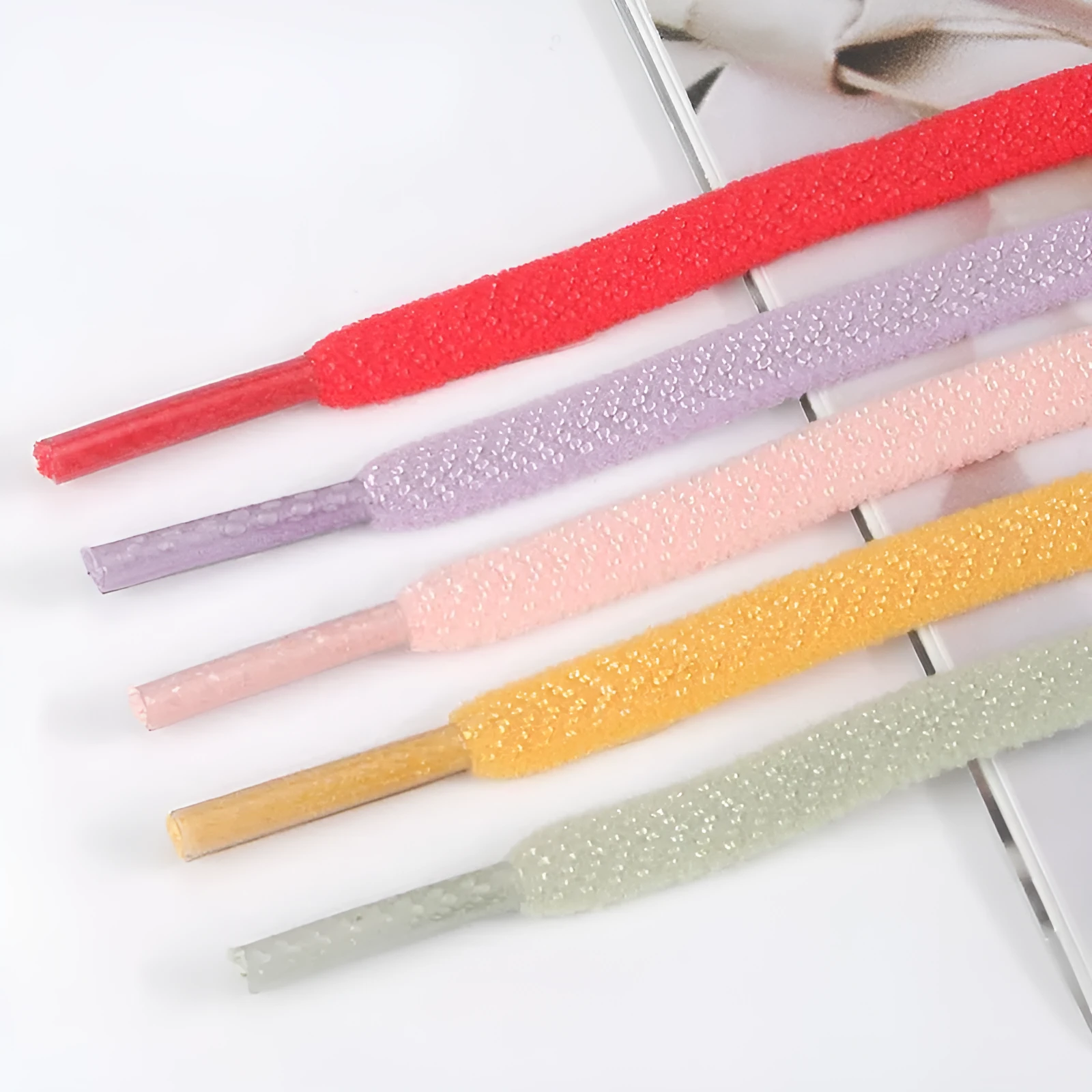 Elastic arrow pattern flat shoelace in multiple colours with 0.6cm width and length options