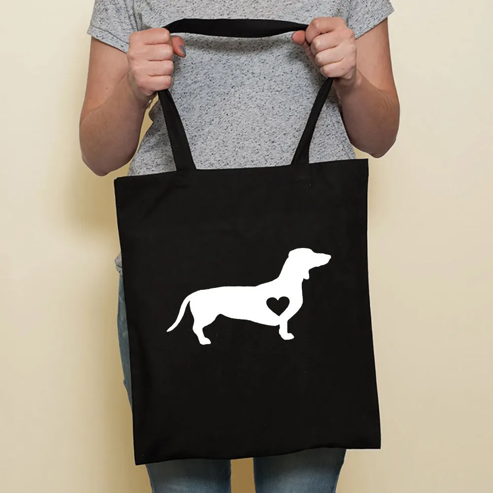 Sausage dog printed canvas bag in black with white dog design on front, sturdy tote for everyday use