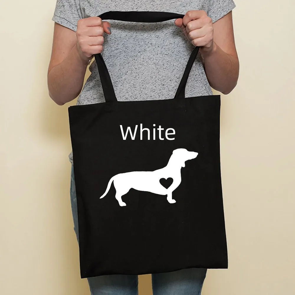 Sausage dog printed canvas bag in black with white dog design on front, sturdy tote for everyday use