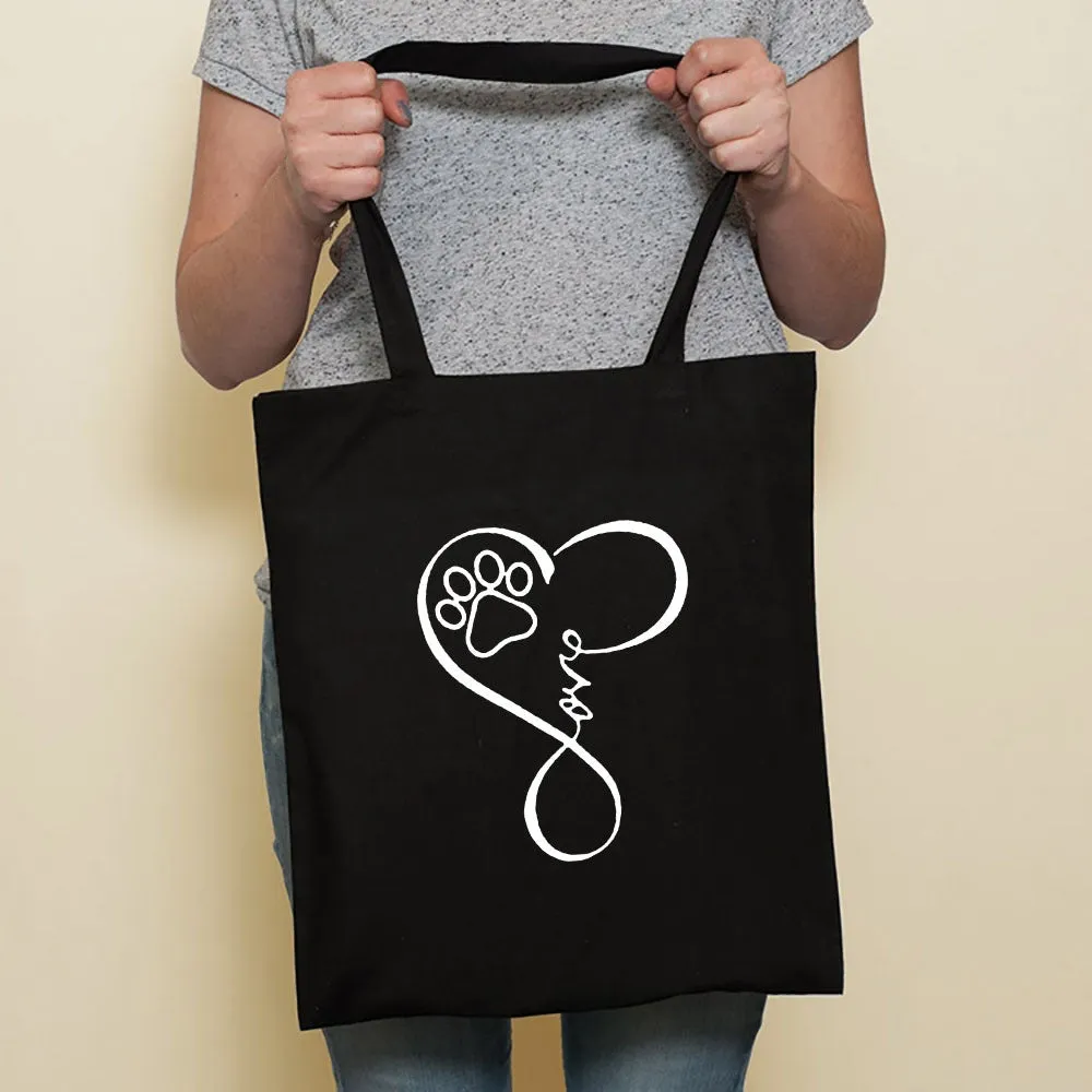 Sausage dog printed canvas bag in black with white dog design on front, sturdy tote for everyday use
