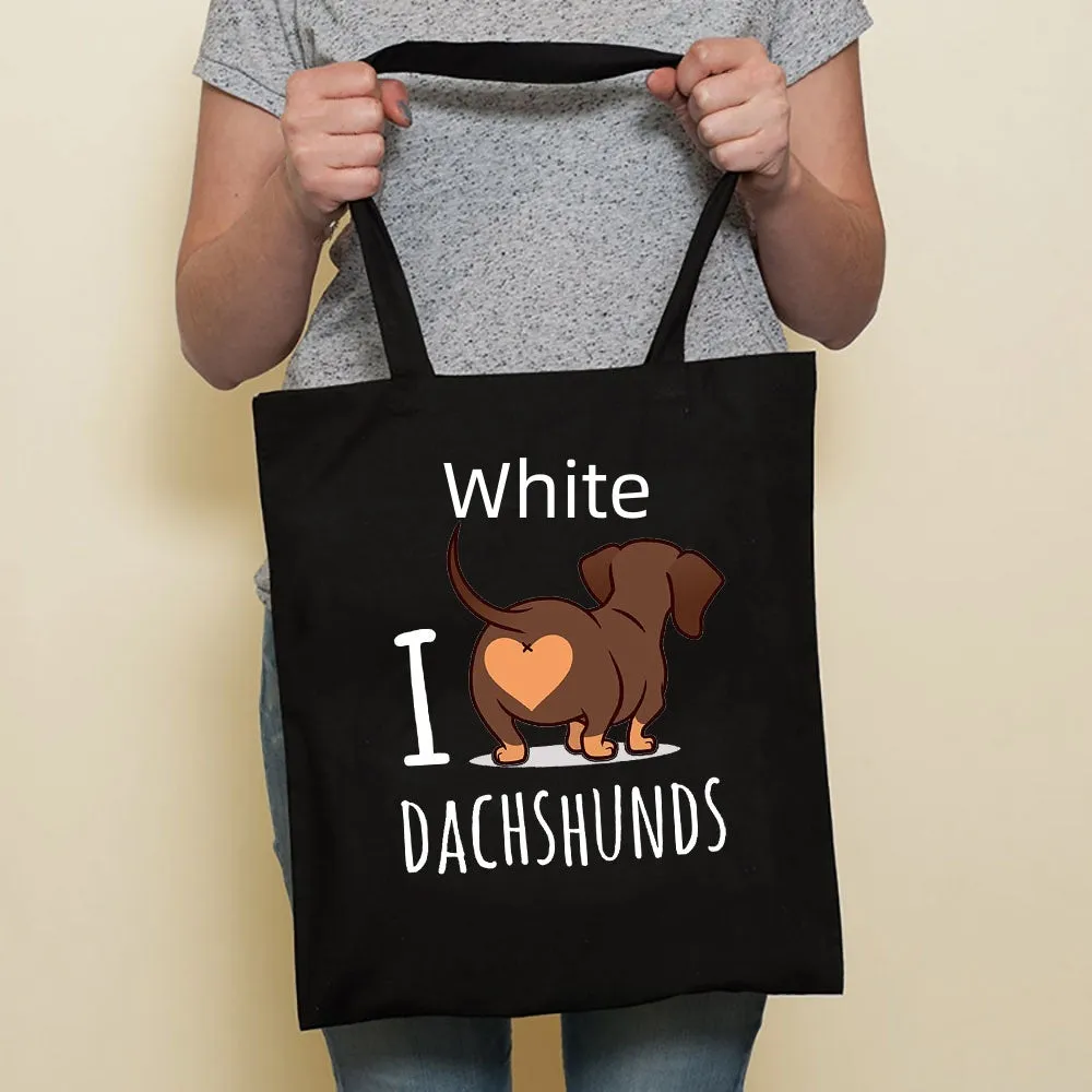Sausage dog printed canvas bag in black with white dog design on front, sturdy tote for everyday use