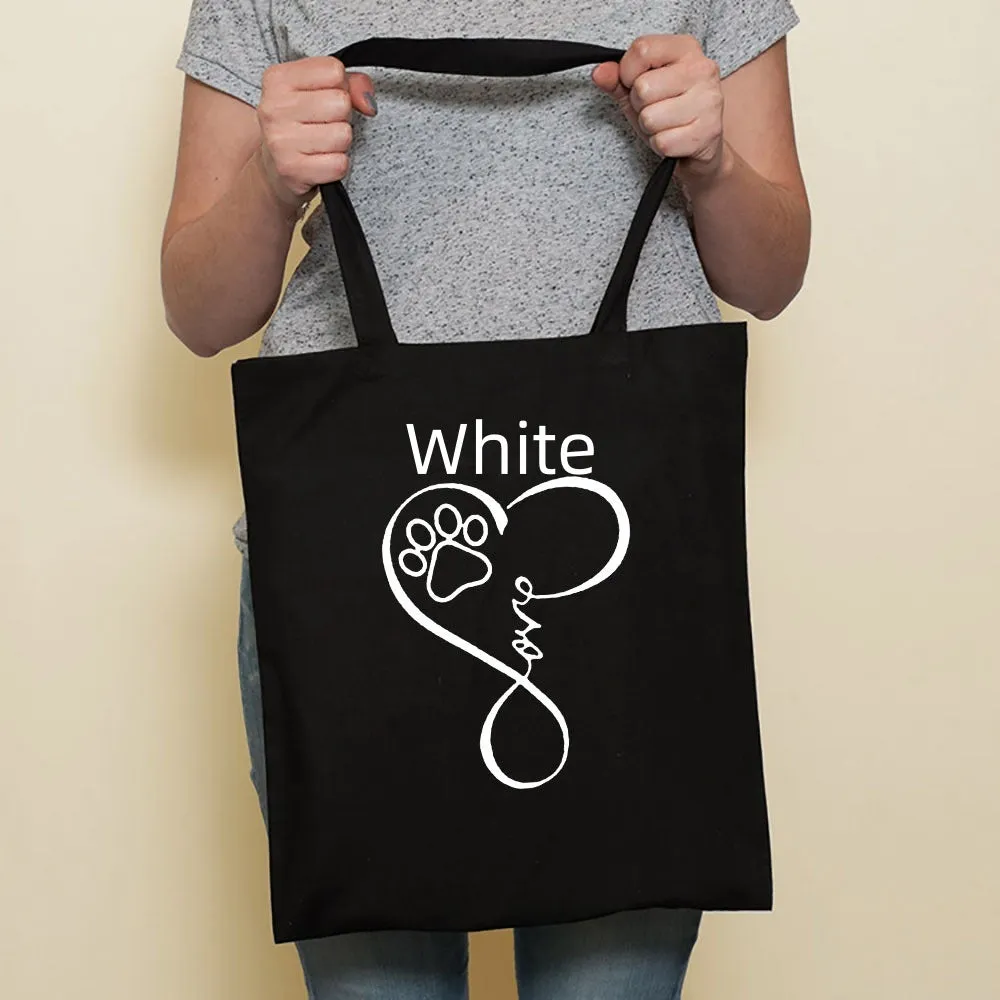 Sausage dog printed canvas bag in black with white dog design on front, sturdy tote for everyday use