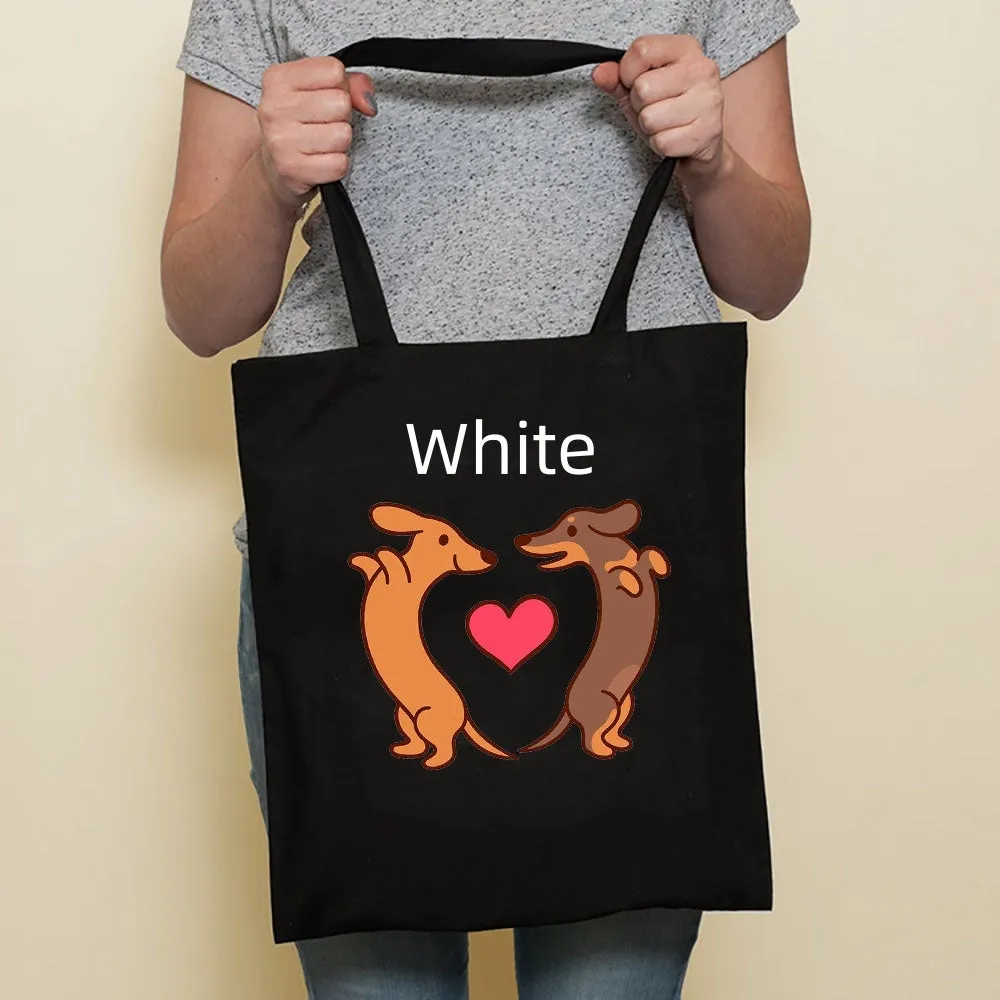 Sausage dog printed canvas bag in black with white dog design on front, sturdy tote for everyday use